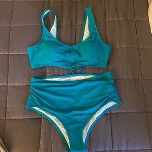 Very pretty teal two piece. Size 1x